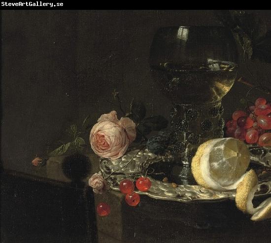 simon luttichuys A 'Roemer' with white wine, a partially peeled lemon, cherries and other fruit on a silver plate with a rose and grapes on a stone ledge